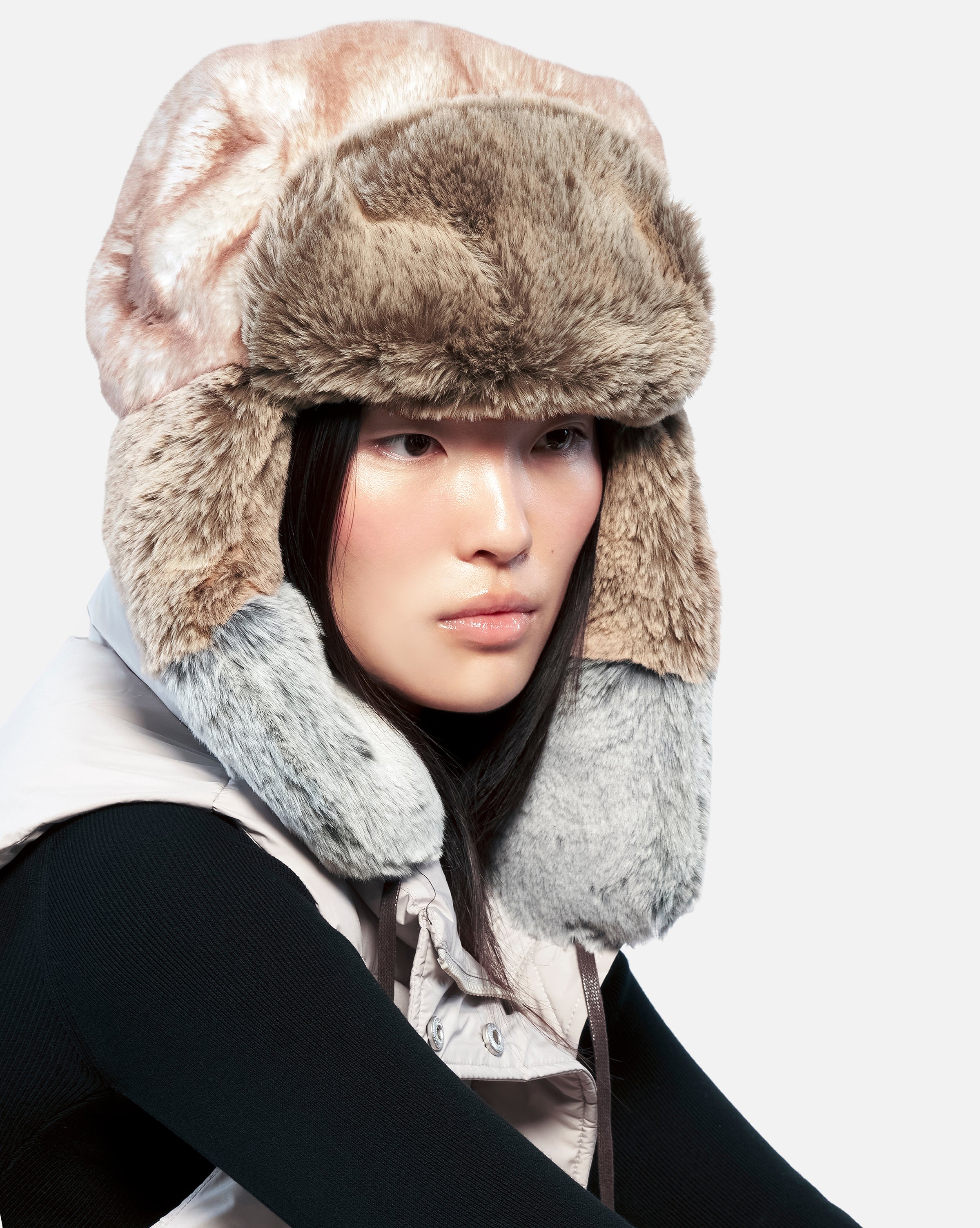 The Multi Faux Fur Trapper will keep you warm as the tempetures drop. It features an oversized crown with padding for the coldest temperatures with earflaps that can be worn up or